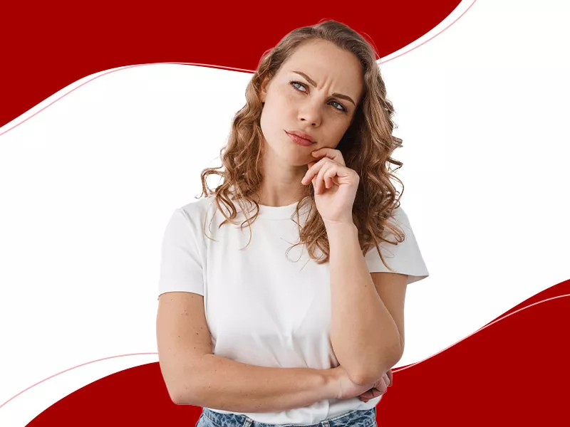 Qual a idade mínima para colocar prótese de silicone? Imagem de mulher pensando na idade mínima permitida para colocar silicone